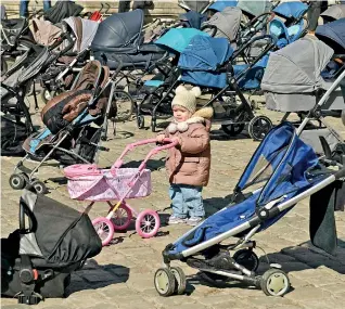  ?? ?? 109 empty strollers are seen placed outside the Lviv city council during an action to highlight the number of children killed in the ongoing Russia's invasion of Ukraine. (AFP)