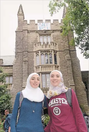  ?? THE HAMILTON SPECTATOR ?? CATHIE COWARD Sisters Shaza and Raghad Mahayni were accepted into McMaster this year after arriving in Canada from Syria in May 2017. Both worked hard to learn English in the shortest time possible. Now the sisters are both in demanding health sciences courses.