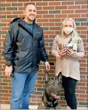  ?? Contribute­d ?? Anna Lundy, owner of Spirit and Sky dog bakery, delivered some of her homemade treats to Polk County Police Sgt. Josh Smith and K-9 Joep last week.