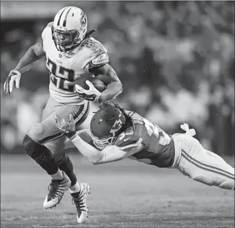  ?? REED HOFFMANN/AP PHOTO ?? Tennessee running back Derrick Henry (22) evades a tackle by Kansas City’s Ron Parker during last week’s NFL wild-card game in Kansas City. Henry set a franchise record with 191 yards from scrimmage, something he hopes to carry over into Saturday’s...