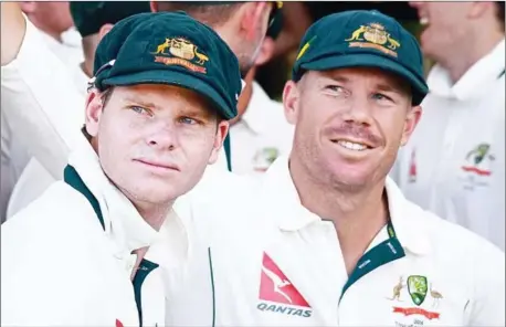  ?? AFP ?? Disgraced Australia skipper Steve Smith and senior batsman David Warner were on Wednesday banned from cricket for 12 months over a cheating scandal that has rocked the sport.