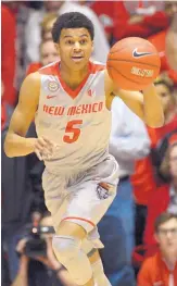  ?? GREG SORBER/JOURNAL ?? UNM’s Jalen Harris (5) has played a bigger role with fellow guard Jordan Hunter nursing an injury.