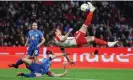  ?? Photograph: A Beier/FC Bayern/Getty Images ?? Harry Kane attempts an audacious finish during Saturday’s 2-1 win over RB Leipzig, when he scored both Bayern Munich goals.