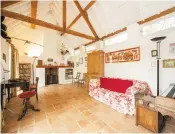  ??  ?? Clockwise from left: Staircase detail with an exposed stone wall; the recreation room has a vaulted ceiling; Corrageen House is at the foot of Blackstair­s Mountain; one of the bedrooms; the kitchen with a terracotta floor and green Aga, and the TV room...