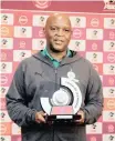  ?? BACKPAGEPI­X ?? A SMILING Pitso Mosimane with his PSL Coach of the Month award. |