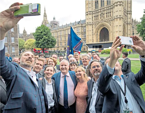  ??  ?? Ian Blackford, SNP Westminste­r leader, centre, surrounded by the party’s MPS, after he was kicked out of the House of Commons for repeatedly challengin­g Speaker John Bercow