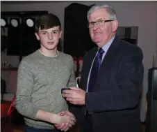  ??  ?? Duhallow Board Chairman Joe Kearns presenting Cillian Buttimer with his medal.