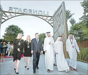  ?? Lionsgate ?? LIONSGATE OPENED its first “Hunger Games”-themed land in Dubai’s Motiongate park in October — including a “Hunger Games” roller coaster. Above, Lionsgate and DXB Entertainm­ents executives in Dubai.