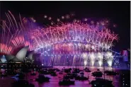  ?? BIANCA DE MARCHI — AAP IMAGE VIA AP ?? Fireworks explode over the Sydney Opera House and Harbour Bridge as New Year celebratio­ns begin in Sydney, Australia, Sunday, Jan. 1, 2023.