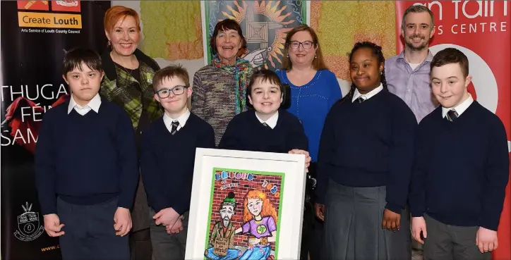  ??  ?? St. Brigid’s School group award winners Arturis Simkute, Kevin Trainer, Aaron Morgan, Anastasia Ioakeim and Tadgh McConville with their painting after receiving their award from Roisin Cotter, Dolores Whelan, Mary Capplis and Paul Hayes.