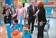  ?? MANDEL NGAN/POOL VIA AP ?? First lady Jill Biden and Education Secretary Miguel Cardona tour Benjamin Franklin Elementary School, Wednesday in Meriden.