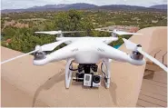  ?? NEW MEXICAN FILE PHOTO ?? Hobbyist drones like this DJI Phantom with an attached GoPro camera have become more common over the past several years. They’ve also interfered with aerial firefighti­ng efforts dozens of times, officials say.