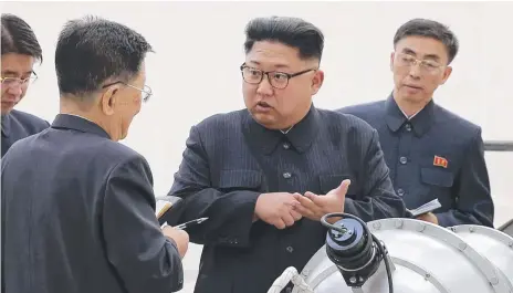  ?? Picture: KOREAN CENTRAL NEWS AGENCY/KOREA NEWS SERVICE VIA AP ?? North Korean leader Kim Jong Un inspects a warhead with his officials.