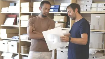  ??  ?? Argentine conceptual artist Erlich (right) talks to Emiliano, one of the designers who works with him, at his studio in Buenos Aires on Mar 9.