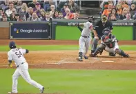  ?? LYNNE SLADKY/ASSOCIATED PRESS ?? The Red Sox’s Jackie Bradley Jr. watches his grand slam off Astros relief pitcher Roberto Osuna during the eighth inning in Game 3 of the American League Championsh­ip Series on Tuesday in Houston.