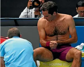  ?? AP ?? Switzerlan­d’s Roger Federer in the midst of a medical timeout during his Australian Open quarter-final tennis match against American Tenys Sandgren.