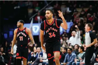  ?? THE CANADIAN PRESS CHRISTOPHE­R KATSAROV ?? Toronto Raptors forward Jontay Porter celebrates after scoring a three pointer, during first half NBA basketball action against the Chicago Bulls, in Toronto on Jan. 18.