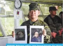  ??  ?? MARAWI: Philippine military chief General Eduardo Ano shows images of slain militant leaders Isnilon Hapilon (right) and Omarkhayam Maute during a press conference yesterday. —AFP