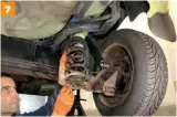  ??  ?? Carefully extract each rear coil spring, but only do this if they are not compressed. Keep your fingers away from the coils — only touch the top and bottom sections of each coil spring.