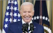  ?? ASSOCIATED PRESS FILE PHOTO ?? President Joe Biden smiles as he speaks in the State Dining Room of the White House in Washington, Nov. 9.