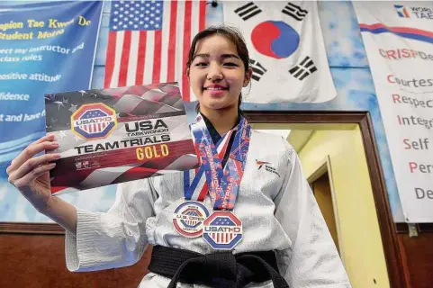  ?? Arnold Gold/Hearst Connecticu­t Media ?? Haley Han, 15, with her most recent awards at World Champion Taekwondo in New Haven on March 9.