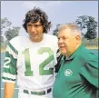  ?? Associated Press file photo ?? Jets quarterbac­k Joe Namath, left, talks with head coach Weeb Ewbank during a 1970 practice. Both were a part of the first Monday Night football game that season when New York visited Cleveland.