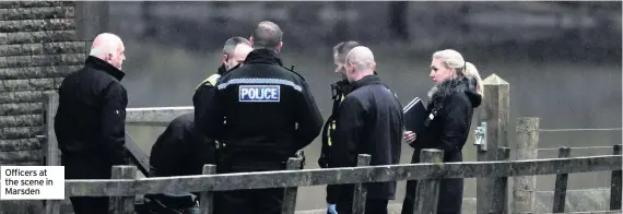  ??  ?? Officers at the scene in Marsden