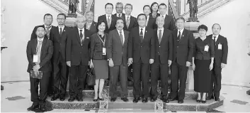  ??  ?? Johari Ghani (front row, sixth right), Prayuth Chan-ocha (front row, fifth right) and Zafrul Aziz (back row, third left) with members of the Kuala Lumpur Business Club pose for a photo at a courtesy call on the Thai Prime Minister during the business...