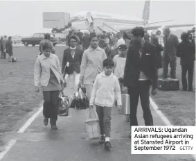  ?? GETTY ?? ARRIVALS: Ugandan Asian refugees arriving at Stansted Airport in September 1972