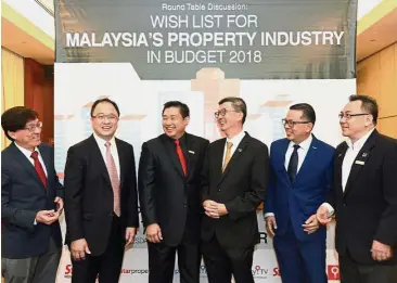  ??  ?? Budget 2018 roundtable: (from left) Ho, Teh, Towle, Lim, Chong and Yip sharing a light moment at the event.