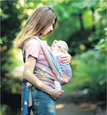  ??  ?? Baby carriers have been found to significan­tly reduce crying and improve the bond between parent and infant. Below are the Babybjorn Baby Carrier One (babybjorn.com), left, and Ergobaby’s Original carrier.