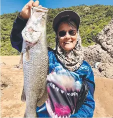  ?? ?? Robyn Riley was rapt catching this fine barramundi while recently fishing at Shelley Beach.