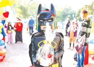  ?? (Flash90) ?? CHILDREN DRESSED in costumes arrive at school ahead of Purim, in Sderot, yesterday.