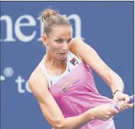  ?? John Minchillo / Associated Press ?? Karolina Pliskova returns to Arena Sabalenka in the second round of the Western &amp; Southern Open on Wednesday.