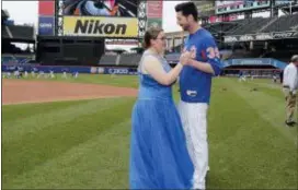  ?? JULIE JACOBSON — THE ASSOCIATED PRESS ?? Mets pitcher Jerry Blevins does a quick dance with Callie Quinn, of Staten Island, N.Y., before Friday’s game. Quinn, 17, tweeted in January that she did not have a date to the prom and asked to take her prom photos at Citi Field. The Mets agreed to...
