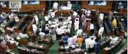  ?? ANI ?? Opposition MPS create uproar in Lok Sabha during the Monsoon Session of Parliament, in New Delhi on Tuesday.