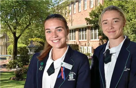  ?? Photo: Bev Lacey ?? YOUNG STARS: St Ursula’s College students Emily Ward (left) and Chloe Hutton are enjoying the challenges of representa­tive football. Ward recently featured in the Australian touch team at the Youth World Cup and Hutton will play for the Queensland under-19 side at the School Sport Australia Football Championsh­ips.