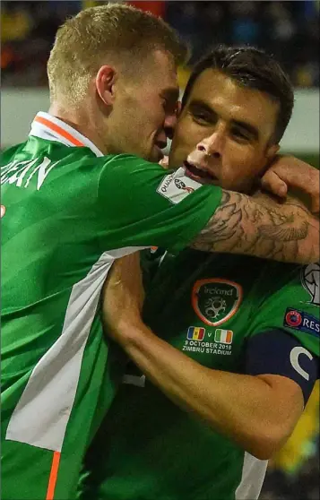  ??  ?? James McClean celebrates with captain Seamus Coleman after scoring Ireland’s second goal.