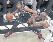  ?? FRANK FRANKLIN II — THE ASSOCIATED PRESS ?? The Brooklyn Nets’ Kevin Durant puts a move on Bucks’ P.J. Tucker in Game 7 of their second-round playoff series.