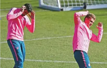  ?? Reuters ?? Atletico Madrid’s Antoine Griezmann and Diego Costa training in Spain yesterday. While Griezmann has lacked firepower this season, Costa can’t play for the team till January.
