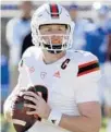  ?? CHRIS
SEWARD/AP ?? Hurricanes quarterbac­k Tyler Van Dyke looks to pass against Duke on Saturday in Durham, N.C.