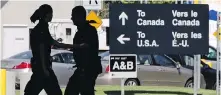  ??  ?? Guards pass each other at an inspection booth at the Douglas port of entry on the Canada-U.S. border in Surrey.