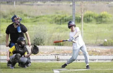  ?? JACK GUEZ/AFP ?? A young player from the Modiin team runs during a baseball match between the Modiin and Jerusalem youth teams in the Israeli city of Modiin on Friday.