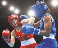  ?? Martin Mejia / Associated Press ?? Virginia Fuchs, left, competes with Colombia’s Ingrit Valencia in the women’s flyweight boxing final bout at the Pan American Games in Lima, Peru.