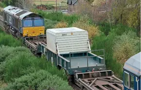  ?? ?? → Similar in design to the original 1970s FNA wagons, the FNA-Ds are operated on trains to Georgemas Junction in the Far North of Scotland in addition to other routes, with DRS Class 66s providing top and tail traction. The wagons are painted green with a white flask cover.