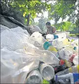  ?? FILE PHOTO ?? A scrap vendor sorts plastic bottles in New Delhi.