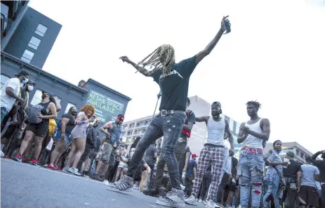  ?? — AFP photo ?? People celebrate Juneteenth at ‘Moechella,’ a go-go music event, on June 19, in Washington, United States. Juneteenth commemorat­es June 19, 1865, when a Union general read orders in Galveston, Texas stating all enslaved people in Texas were free according to federal law.