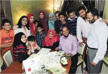  ?? Arshad Ali/Gulf News ?? One for the album Syed Noor Mohammad with his extended family. His five children were all born in Dubai. Mohammad, who hails from Mangalore, had arrived by sea at Dubai Creek in 1963.