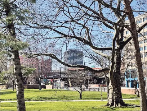  ?? Hearst Connecticu­t Media file photo ?? A view from Bushnell Park of The Hartford’s headquarte­rs building at One Hartford Plaza, at center, in Hartford.