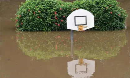  ?? Photograph: Darren England/AAP ?? ‘The water was slow rising, and with that, it’s normally slow getting away,’ said local police superinten­dent Michael Sawrey.